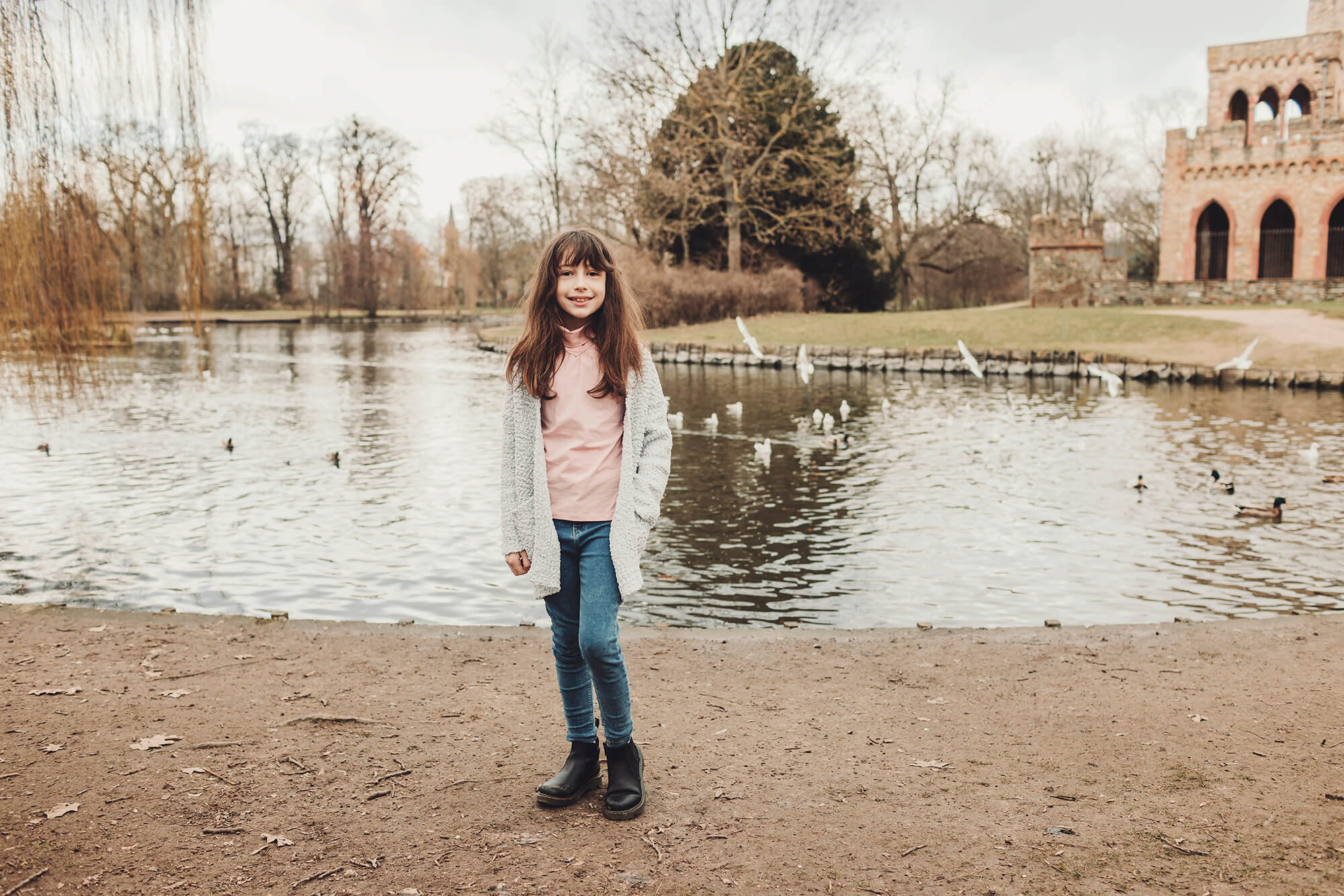 Little girl Castelli by the Biebrich park lake during a family photo session in Wiesbaden